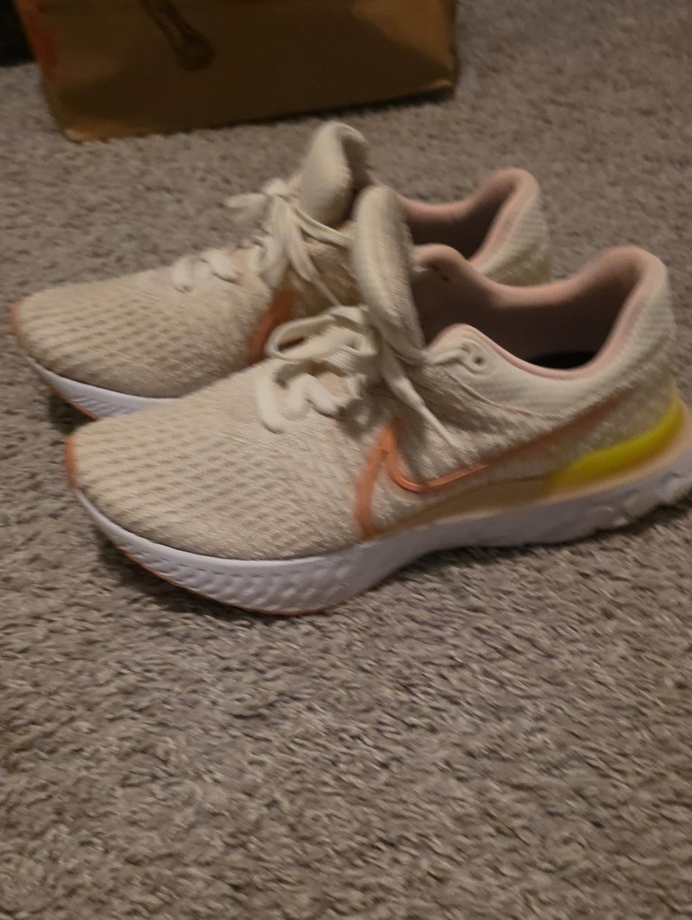 Women's Size 10 Nike Cream Knit Athletic Sneakers with Peach and Yellow Accents